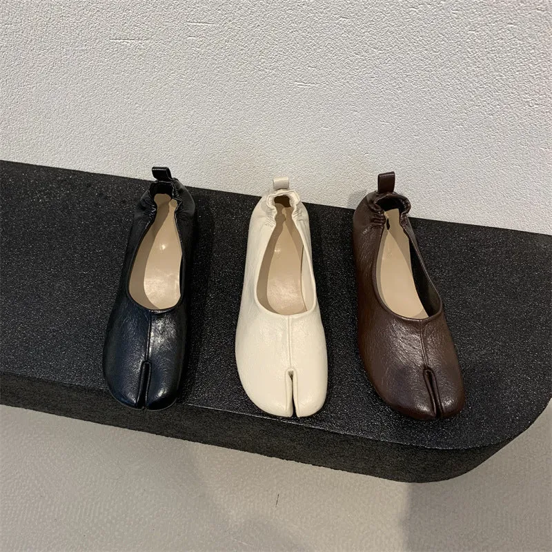 Women's apricot coloured chunky heel pumps with split toe horseshoe detail and round toe.