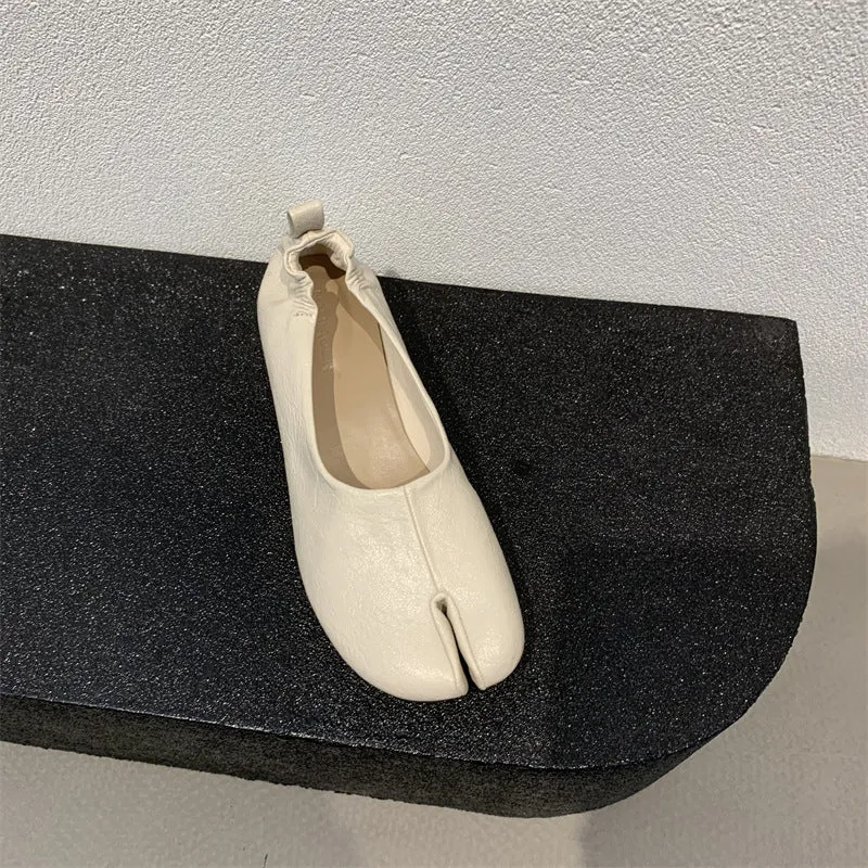 Women's apricot coloured chunky heel pumps with split toe horseshoe detail and round toe.