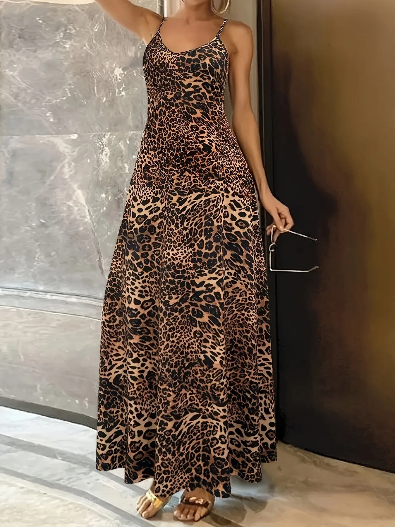 Dark brown leopard print sleeveless dress with round neck and loose-fitting long skirt.