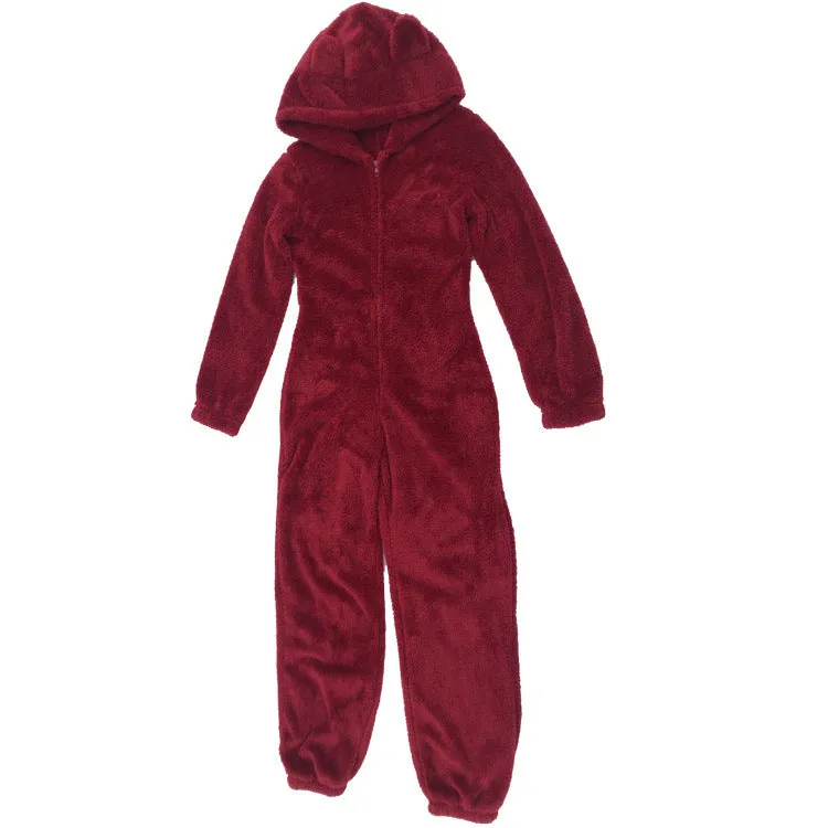 Fleece-lined thickened furry hooded jumpsuit pajama with zipper, loose fit, warm red colour lounging on bed