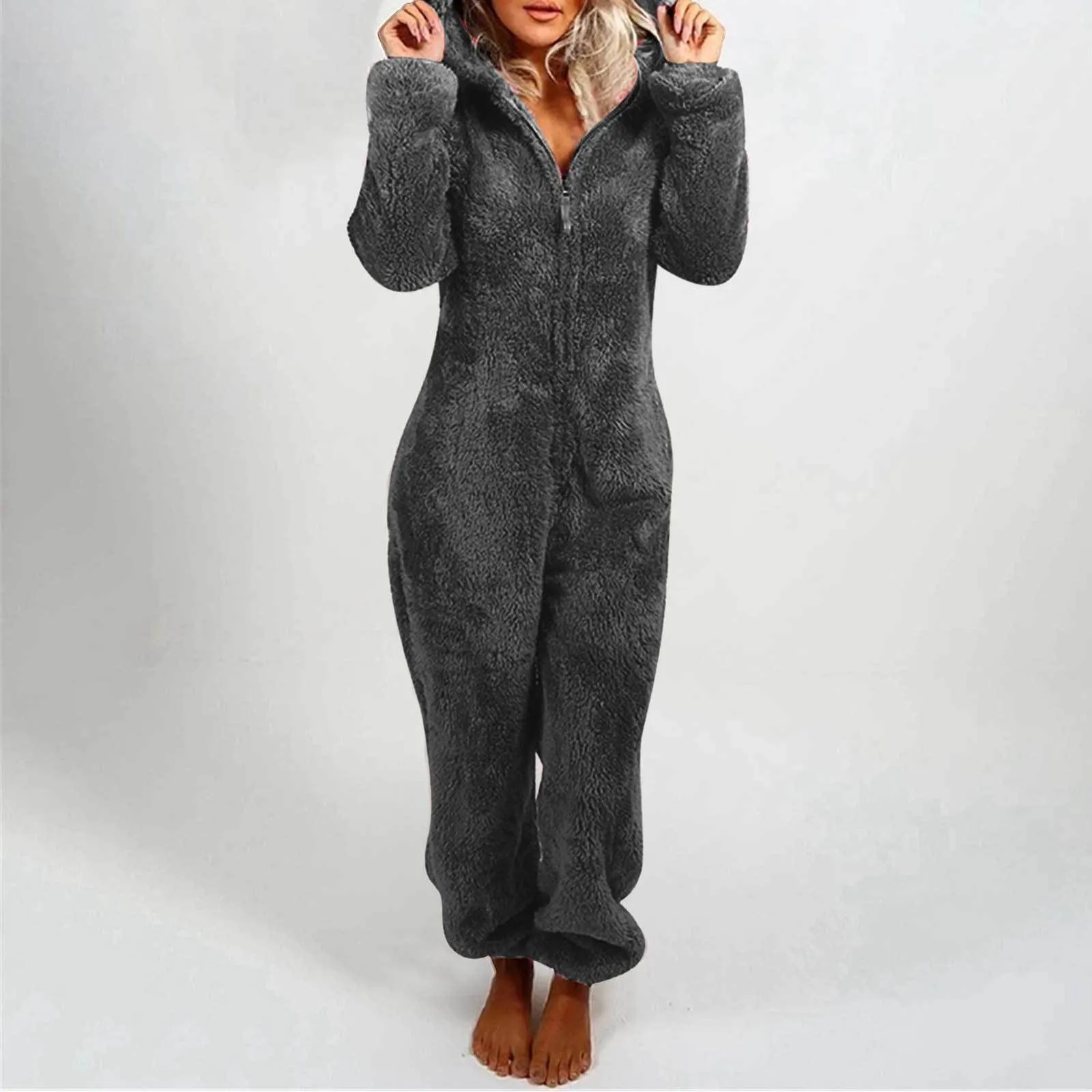 Fleece-lined thickened furry hooded jumpsuit pajama with zipper, loose fit, warm red colour lounging on bed