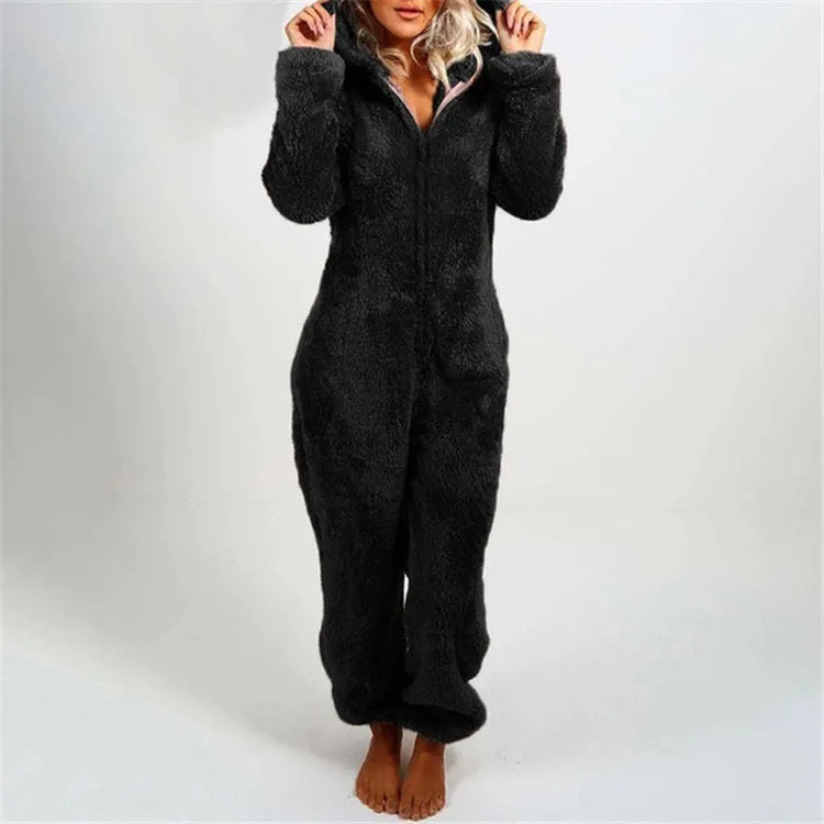 Fleece-lined thickened furry hooded jumpsuit pajama with zipper, loose fit, warm red colour lounging on bed