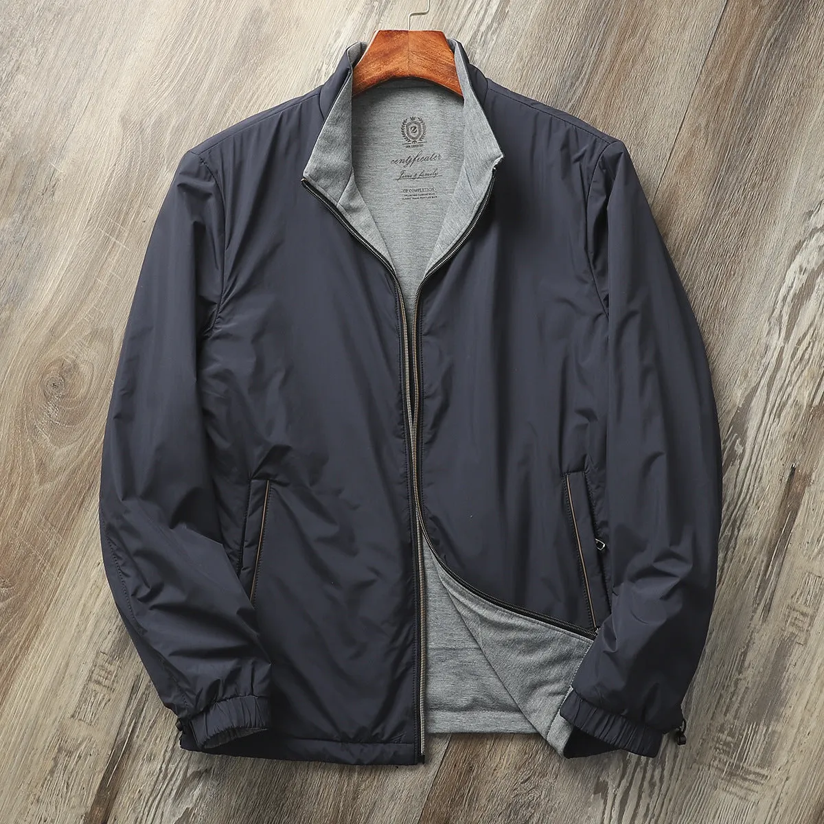 Man wearing a simple stand collar casual jacket in army green, showing the regular fit and cotton lining.