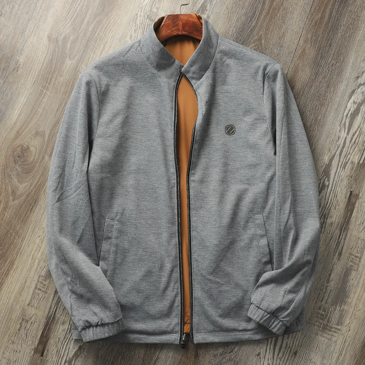 Man wearing a simple stand collar casual jacket in army green, showing the regular fit and cotton lining.