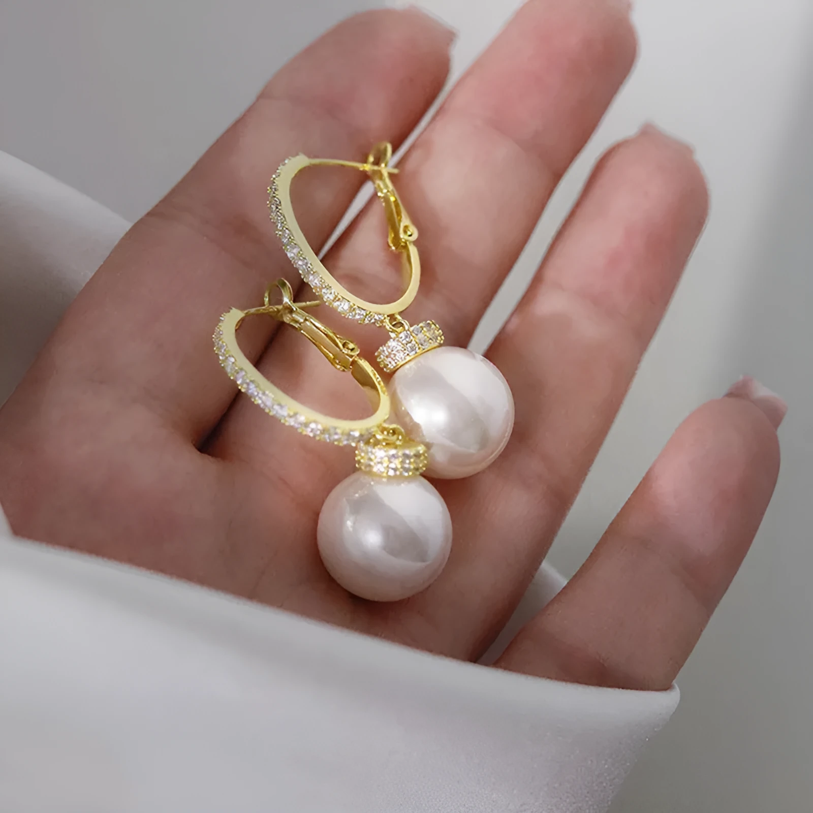 Yellow gold copper earrings with imitation pearl and inlaid zircon geometric ring design
