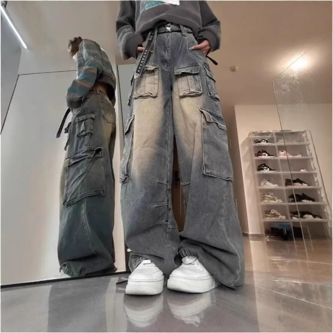 Man wearing loose light blue distressed jeans with multiple pockets, showcasing the straight-leg and utility style.