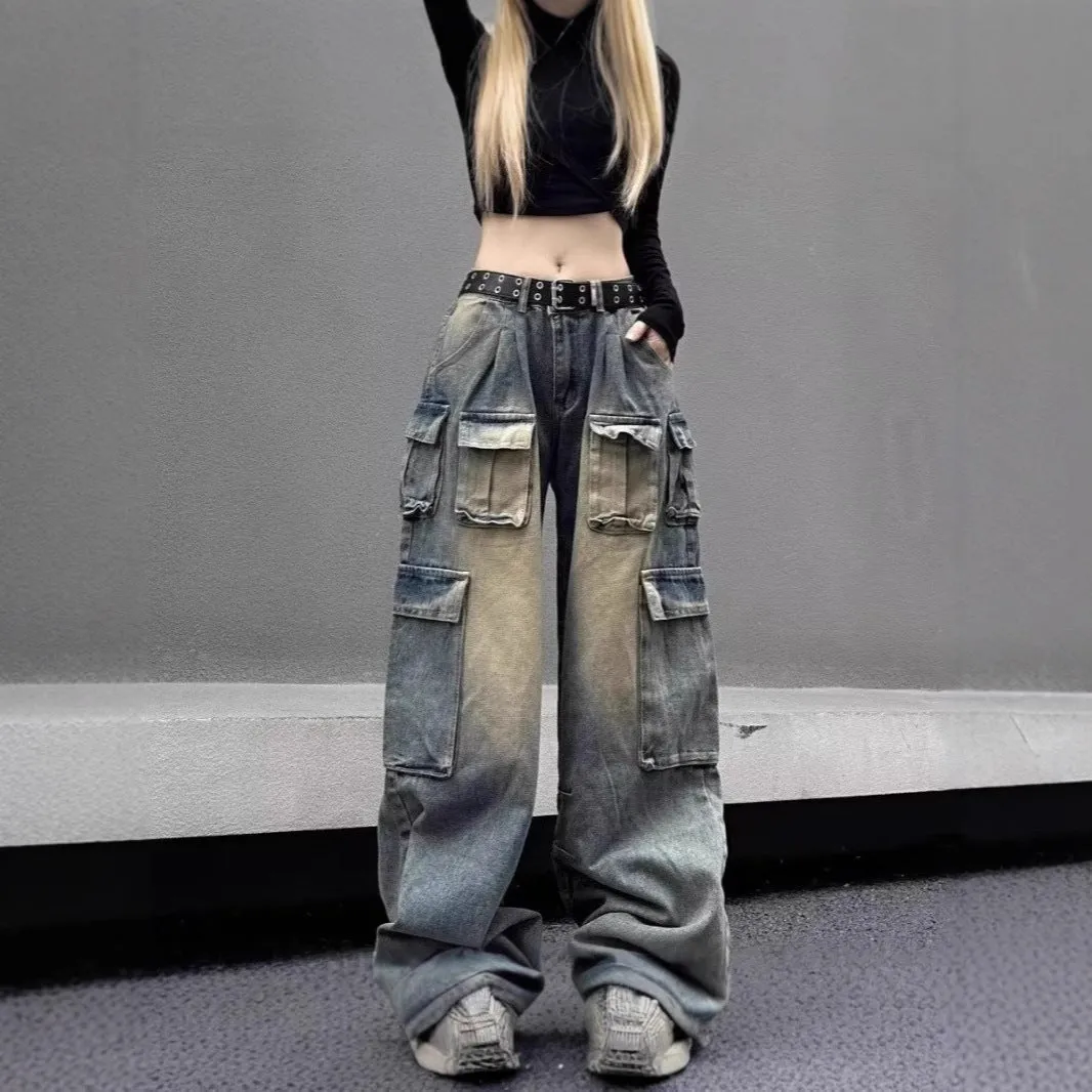 Man wearing loose light blue distressed jeans with multiple pockets, showcasing the straight-leg and utility style.