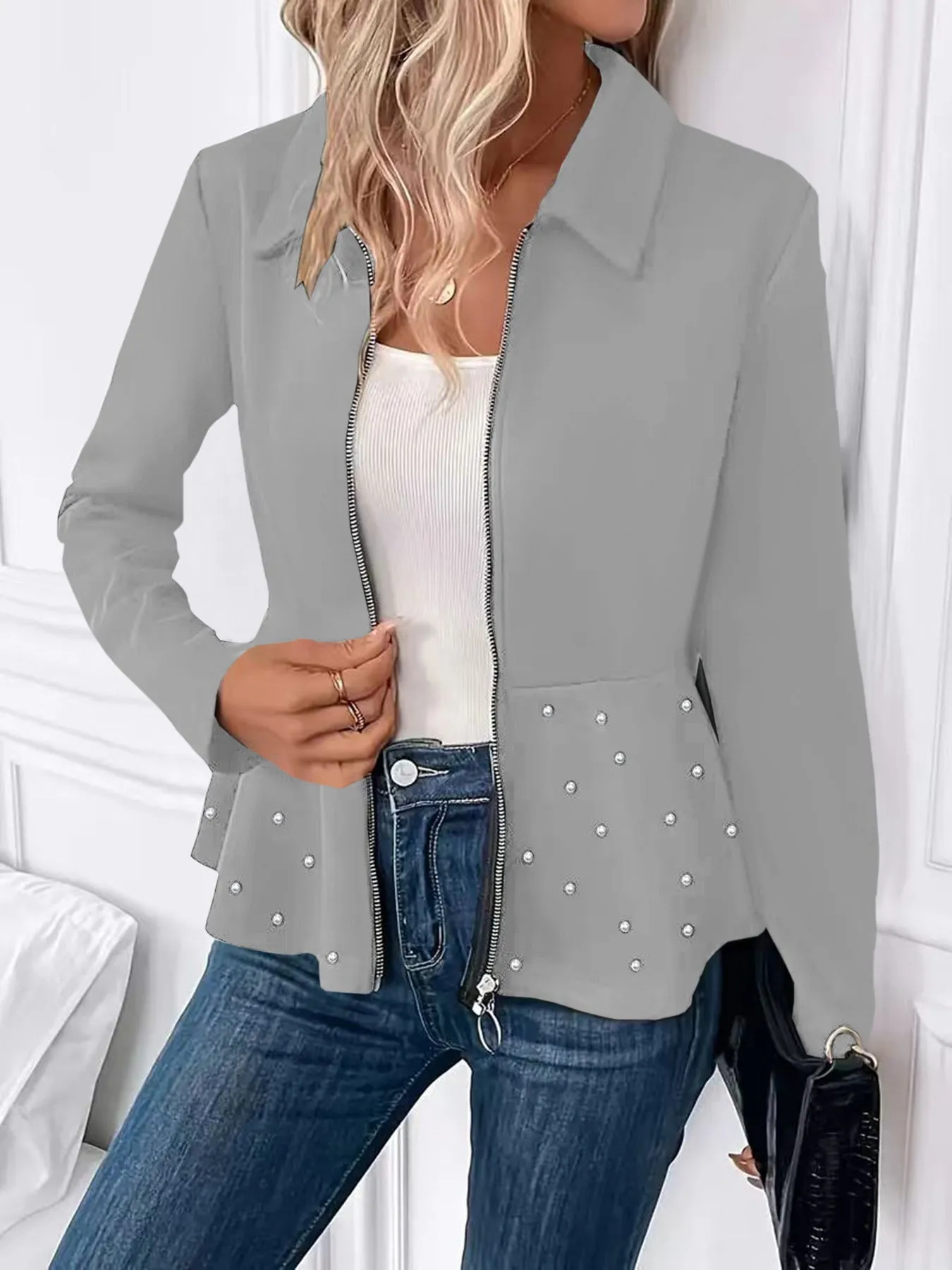 Women's black loose fit coat with beaded front zipper and ruffle hem detail, long sleeves