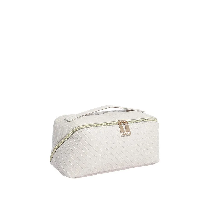 Waterproof large capacity PU storage bag in white, open showing cosmetics inside