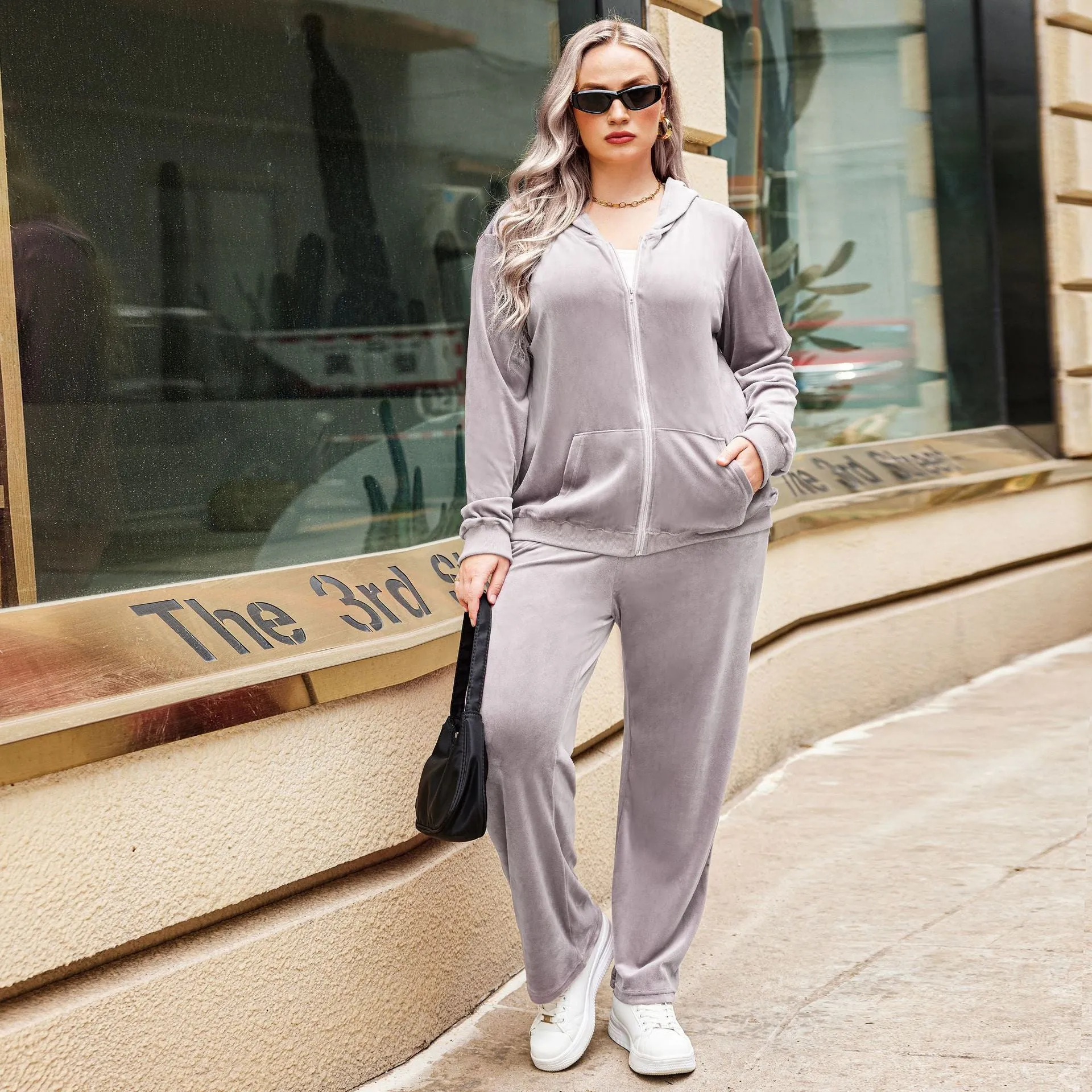 Plus size women's sports hooded tracksuit set in dark purple with long sleeves and full-length trousers, autumn winter style
