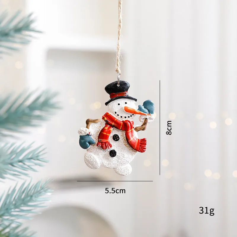 Small resin Christmas tree pendant ornament with a snowman figure holding a broom