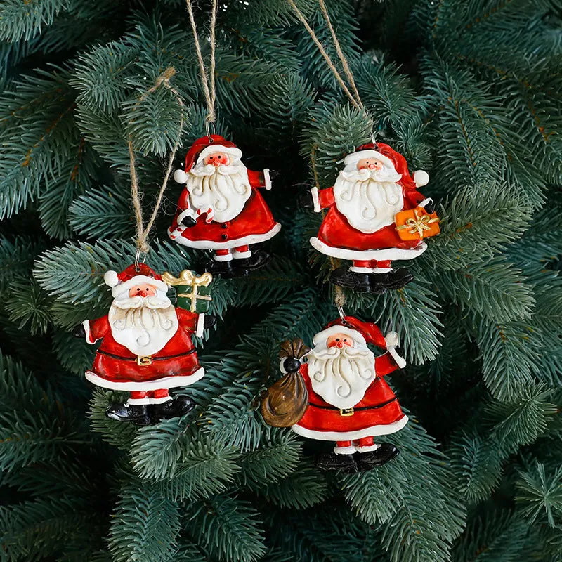 Small resin Christmas tree pendant ornament with a snowman figure holding a broom