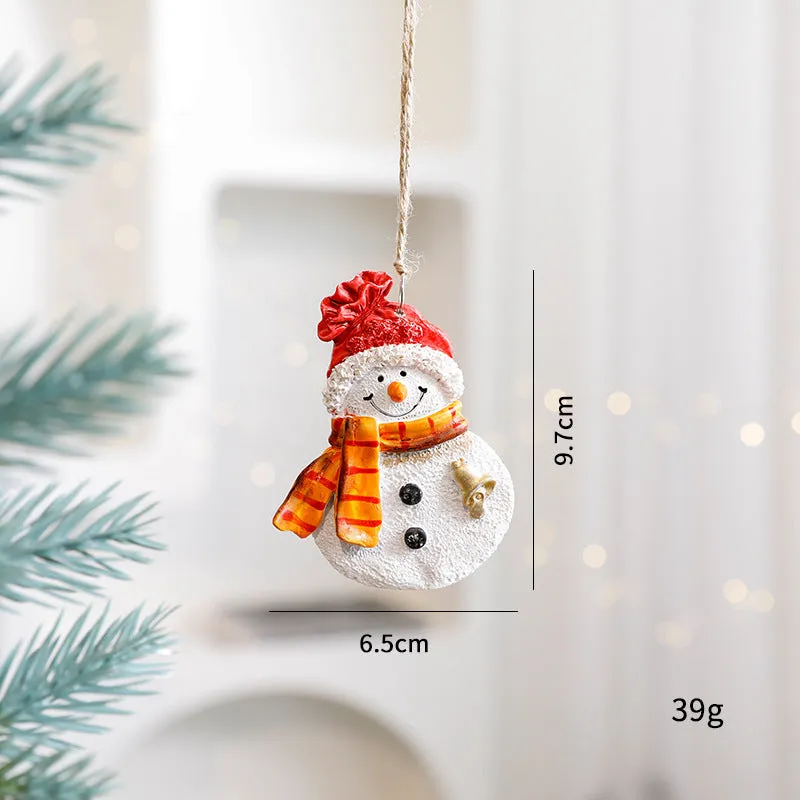 Small resin Christmas tree pendant ornament with a snowman figure holding a broom