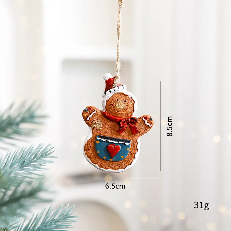 Small resin Christmas tree pendant ornament with a snowman figure holding a broom