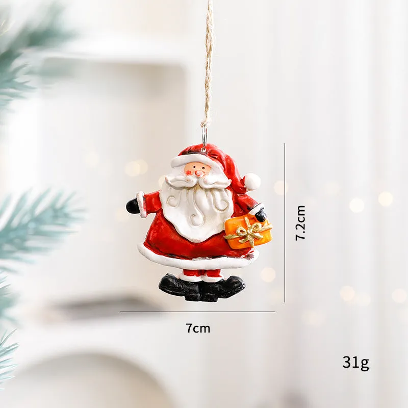 Small resin Christmas tree pendant ornament with a snowman figure holding a broom