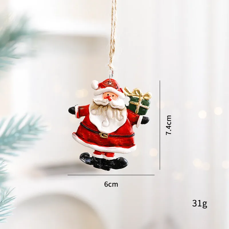 Small resin Christmas tree pendant ornament with a snowman figure holding a broom