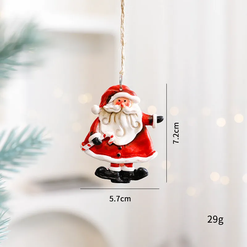 Small resin Christmas tree pendant ornament with a snowman figure holding a broom