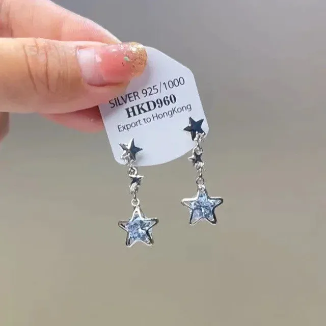 Geometric gold electroplated alloy ear clip jewellery with rhinestone and little stars tassel decoration