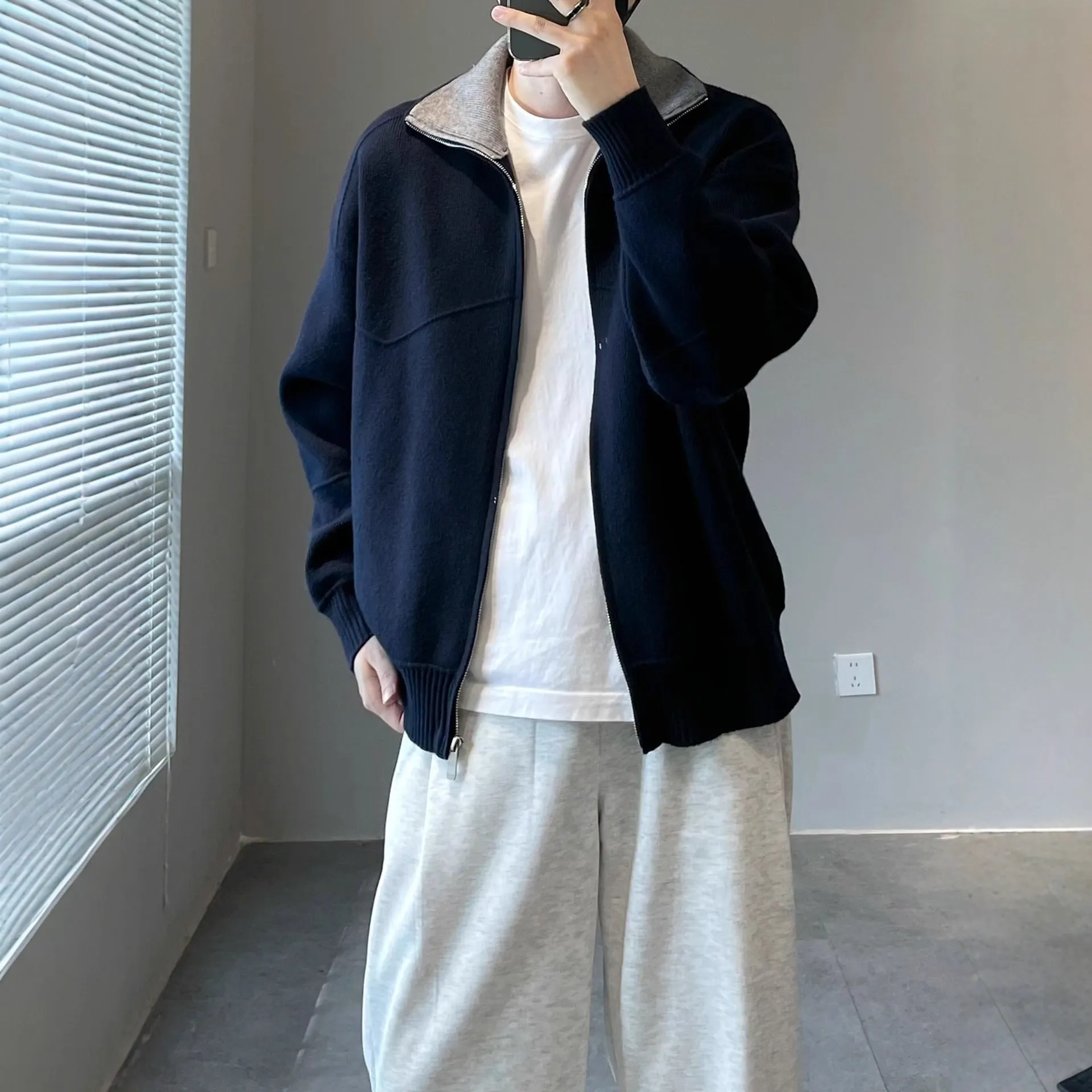 Men's loose fit contrast colour knitted cardigan sweater in apricot, front view, long sleeves, retro style