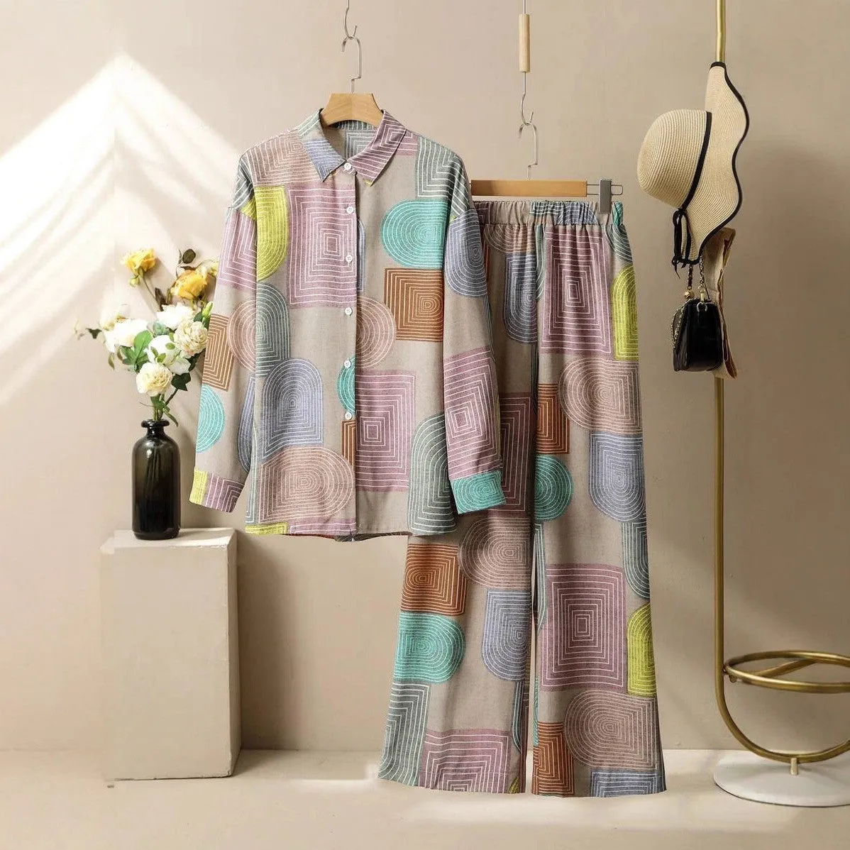 Women's geometric print long sleeve trouser suit in polyester with button detail, casual style