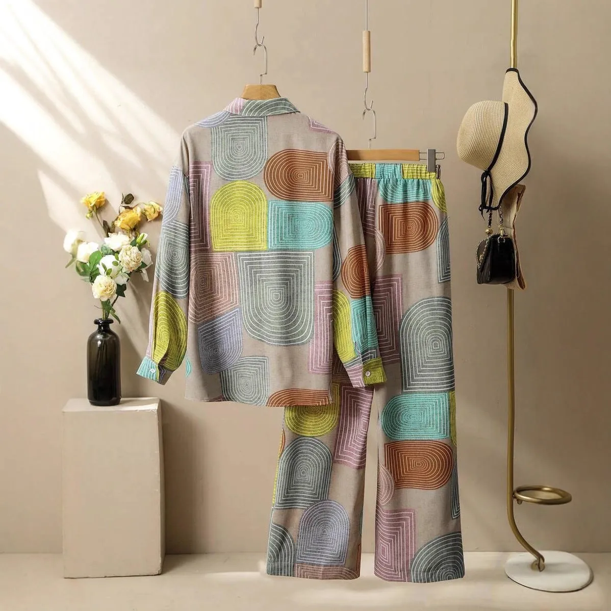 Women's geometric print long sleeve trouser suit in polyester with button detail, casual style