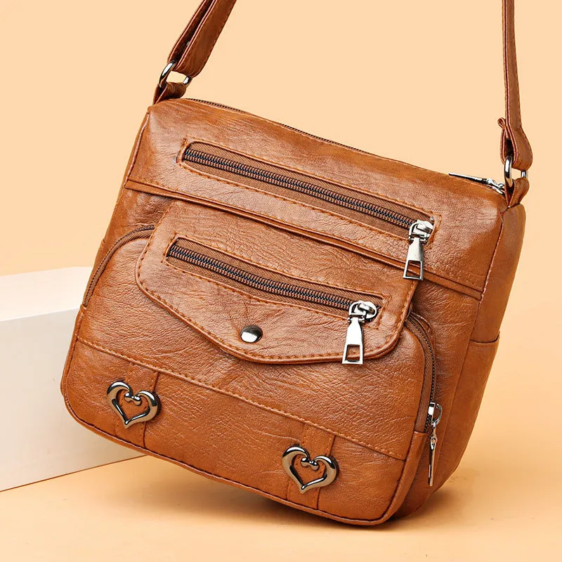 Soft PU crossbody shoulder bag with multi-pocket design in urban simplicity style, available in brown colour