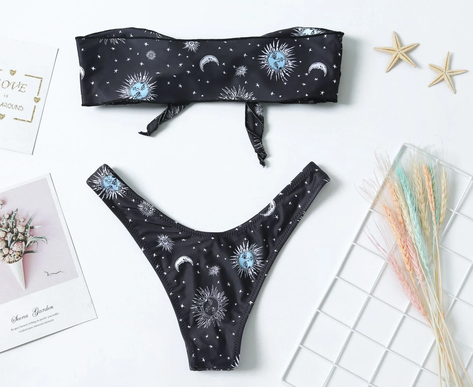 Black one-piece swimsuit with split tube top and backless design for swimming