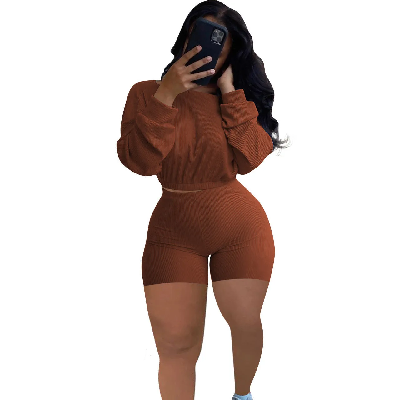 Off-the-shoulder long sleeve top and shorts two-piece set in a solid colour with a sunken stripe pattern.