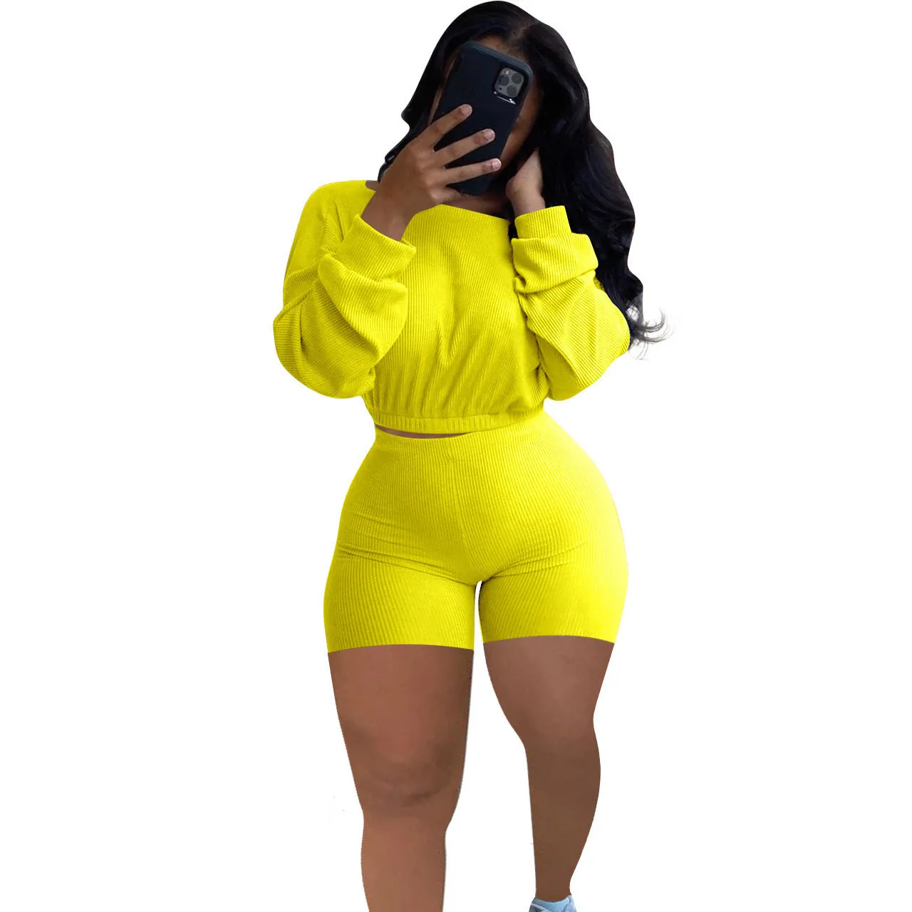 Off-the-shoulder long sleeve top and shorts two-piece set in a solid colour with a sunken stripe pattern.