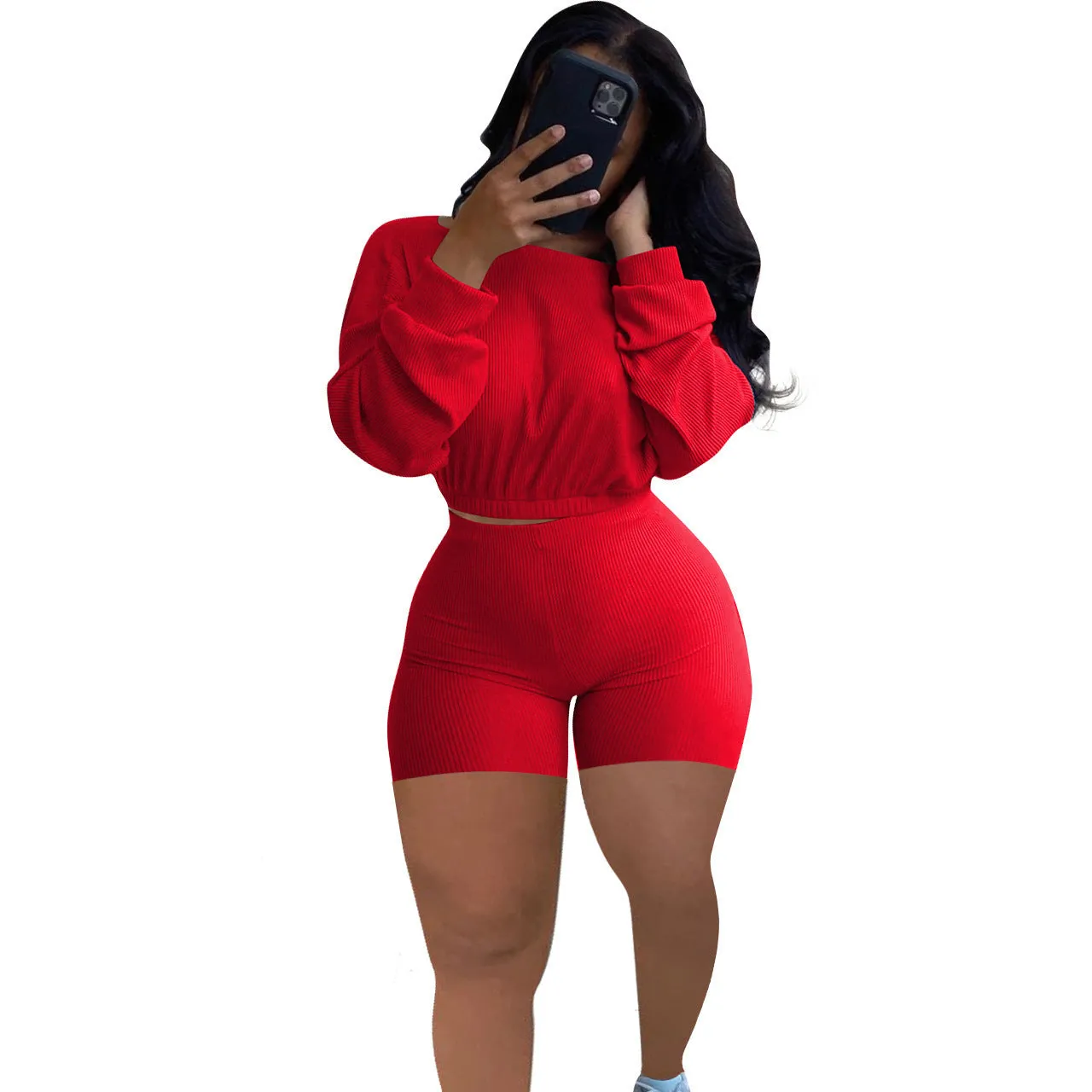 Off-the-shoulder long sleeve top and shorts two-piece set in a solid colour with a sunken stripe pattern.
