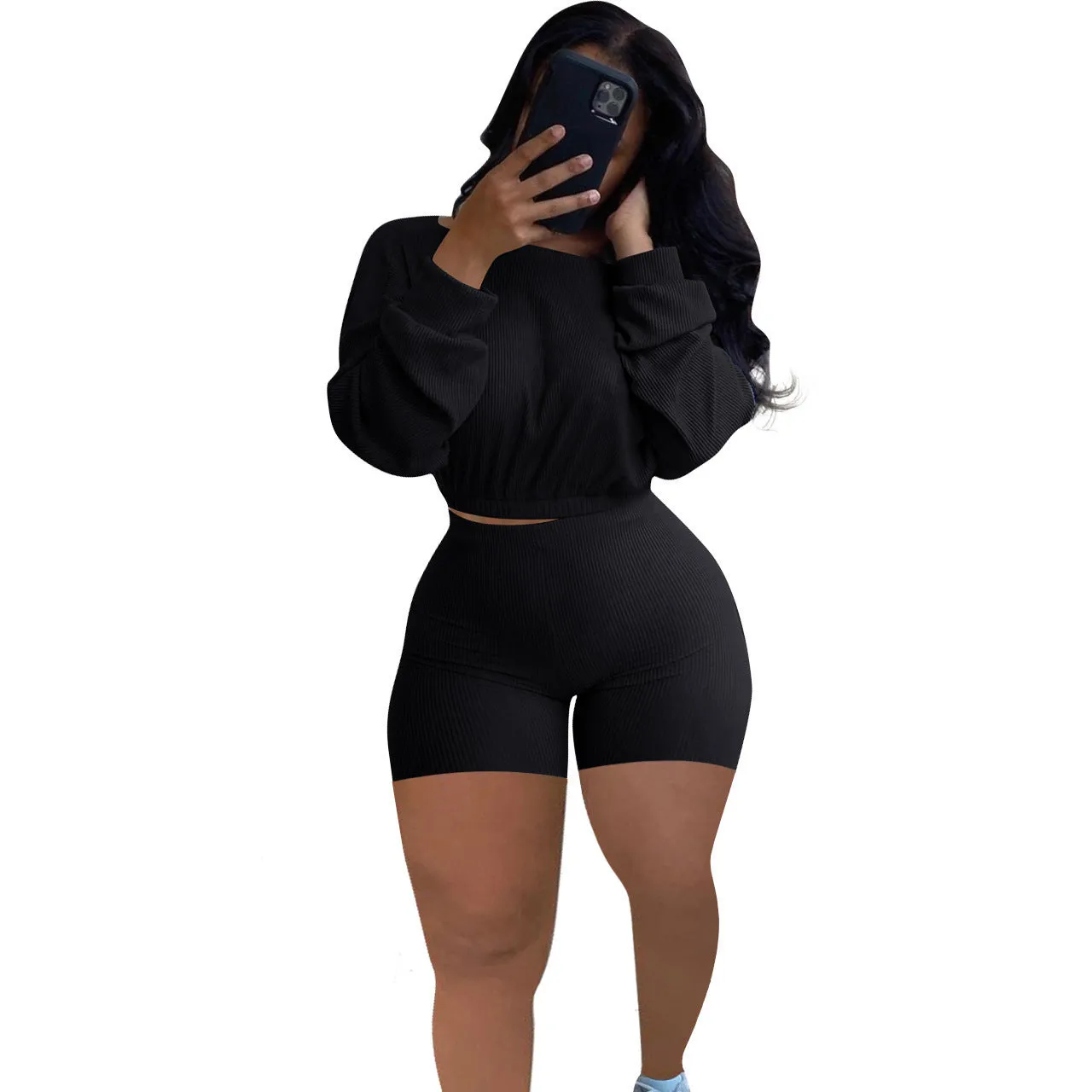 Off-the-shoulder long sleeve top and shorts two-piece set in a solid colour with a sunken stripe pattern.