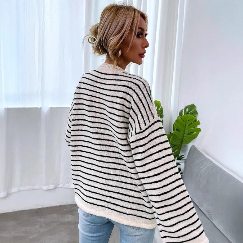 Black striped women's casual top with drop shoulders and button detailing