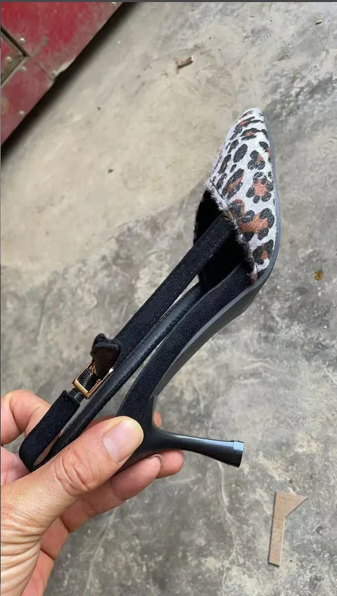 Leopard print suede women's sandals with a scattered pointed toe design on a high heel.