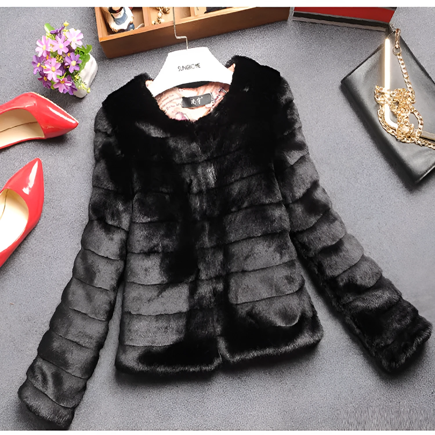 Women's short-length faux fur top in beige, shown on a model as part of a street fashion outfit.