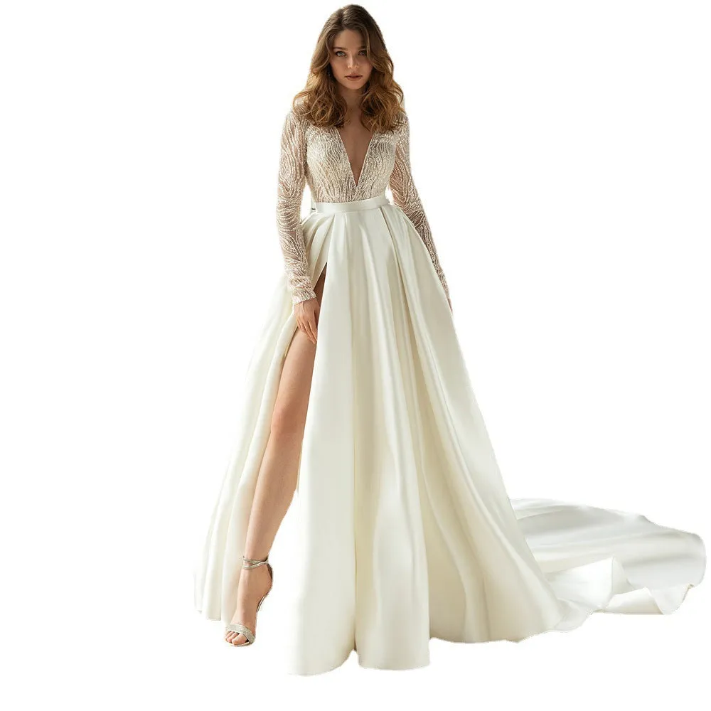 Women's white long sleeve hollow-out dress with gilded detailing, long skirt, and mid-waist cut