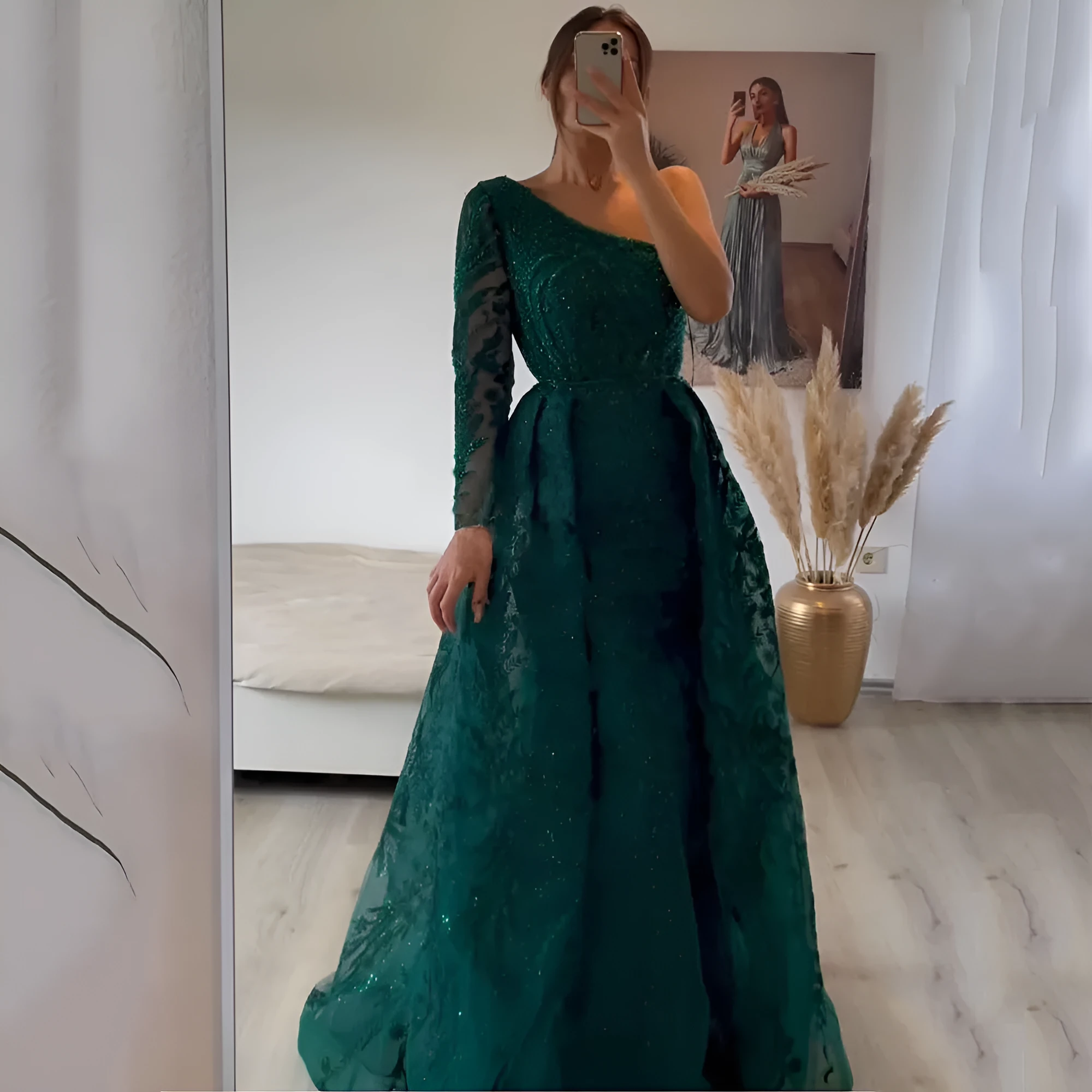 Women's slim-fit fishtail mesh shoulder long-sleeved dress in green with zipper detail on model
