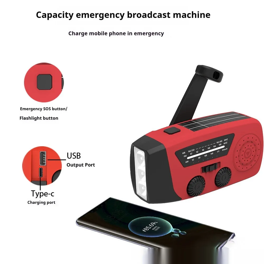 Red rechargeable hand-held emergency radio with integrated torch and wrist strap.