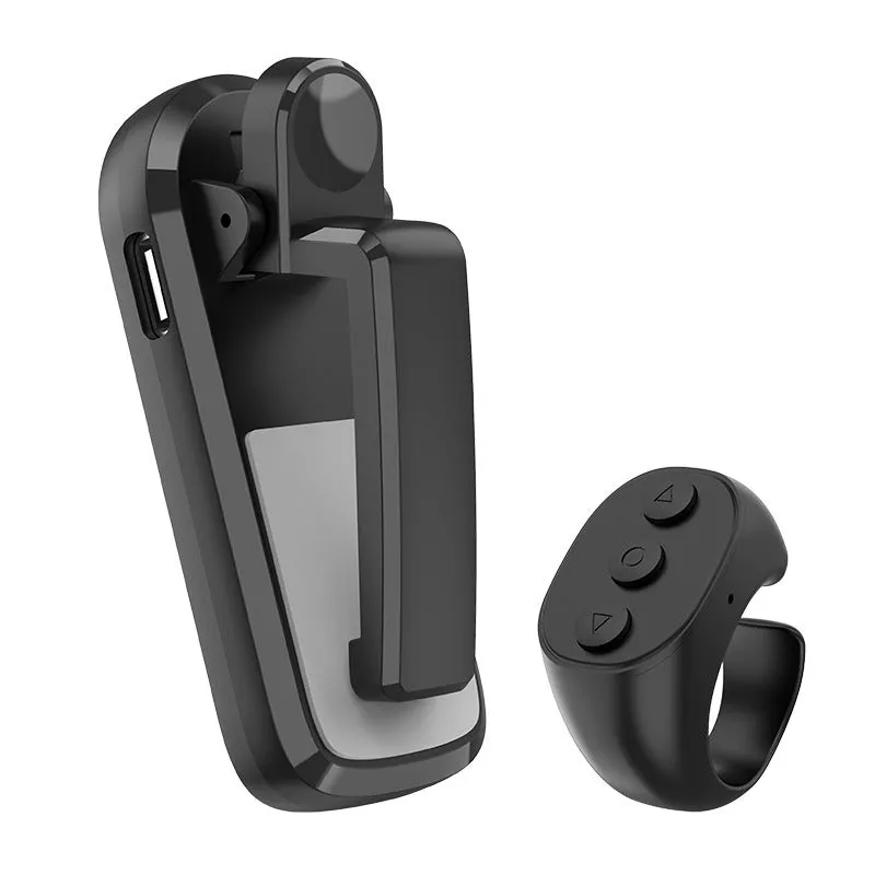 Black wireless page turner remote and clicker for tablets on a wooden table.