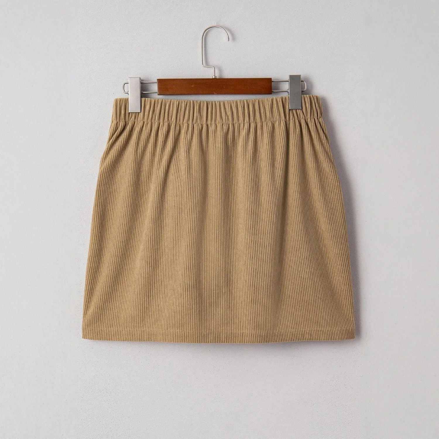 Women's corduroy hip skirt in coffee colour with button detail, short length, polyester fabric