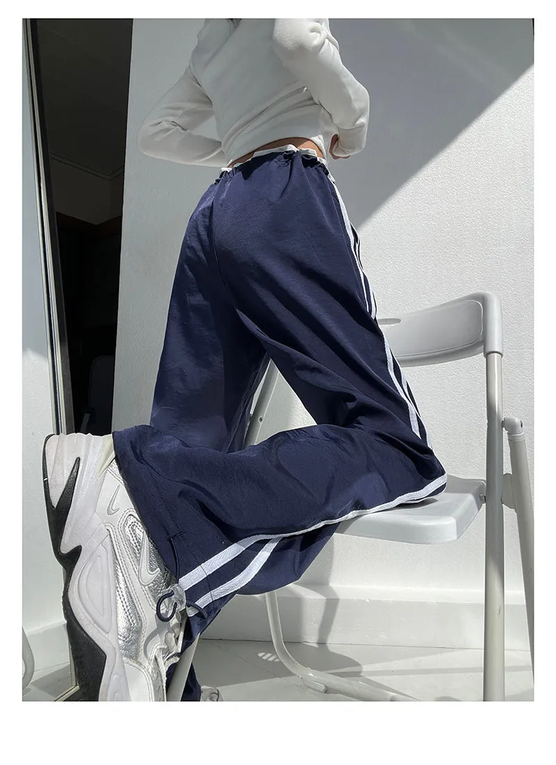 Women's navy blue loose straight pants with white contrast ribbon parallel bars detail and low waist