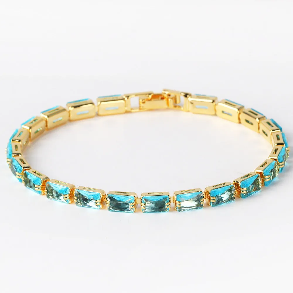 Electroplated zircon bracelet for women with gold tone finish and blue zircon stones