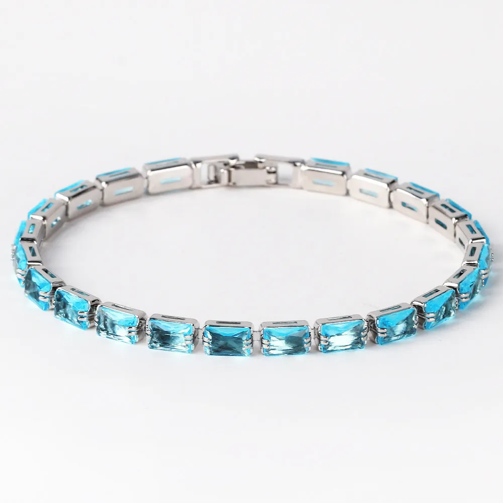 Electroplated zircon bracelet for women with gold tone finish and blue zircon stones