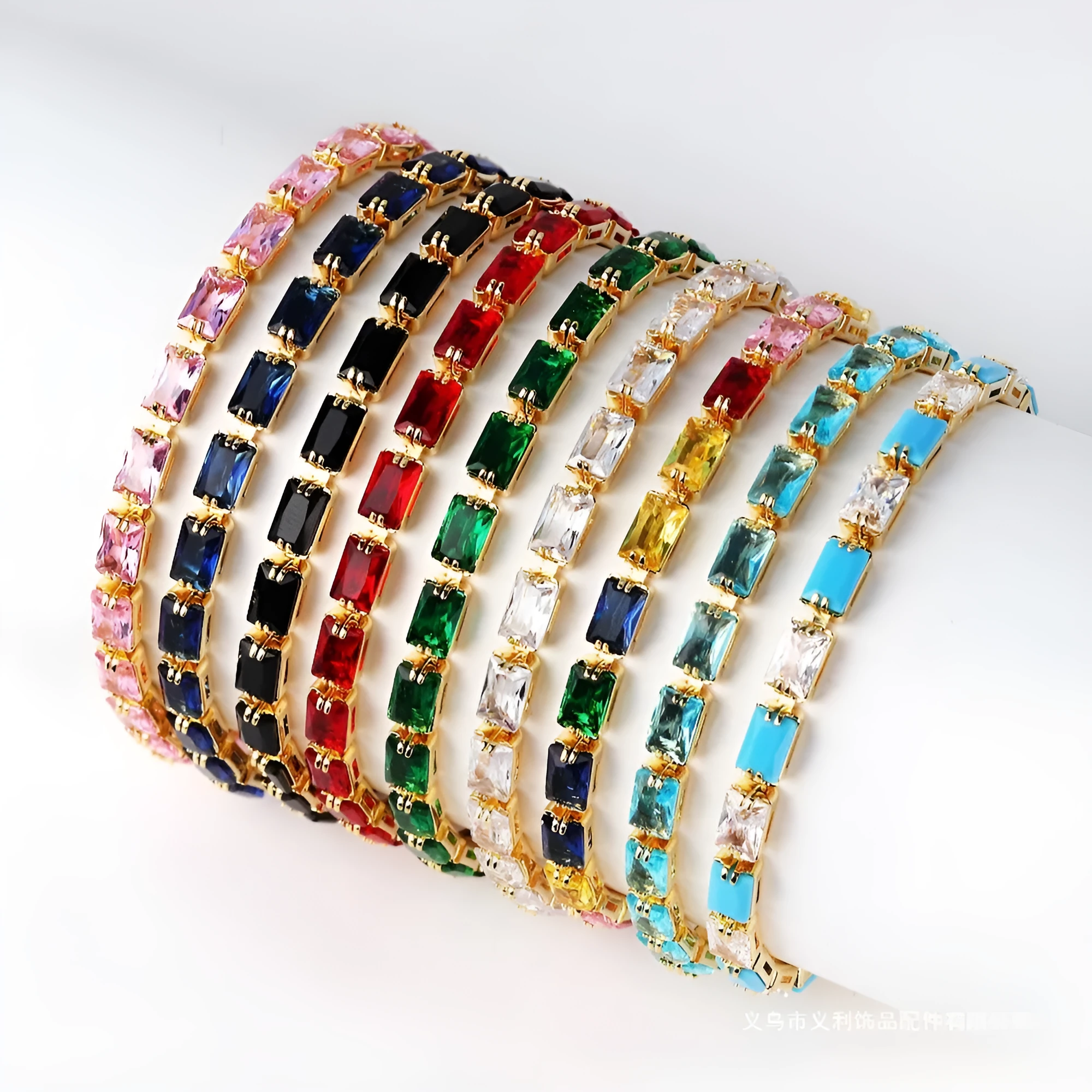 Electroplated zircon bracelet for women with gold tone finish and blue zircon stones