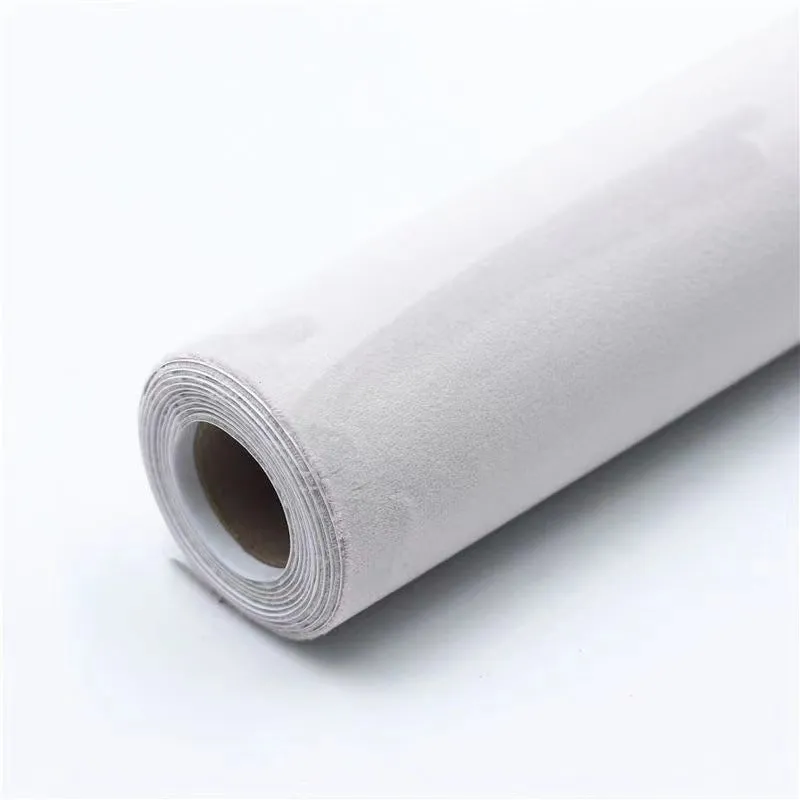 Self-adhesive leather suede sheet in beige colour showing texture and adhesive backing.