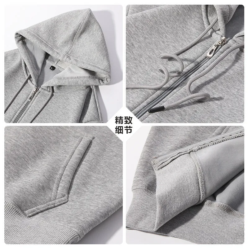 Man wearing a beige heavyweight zip-up hooded sweater, showing top-stitched pockets and loose fit.