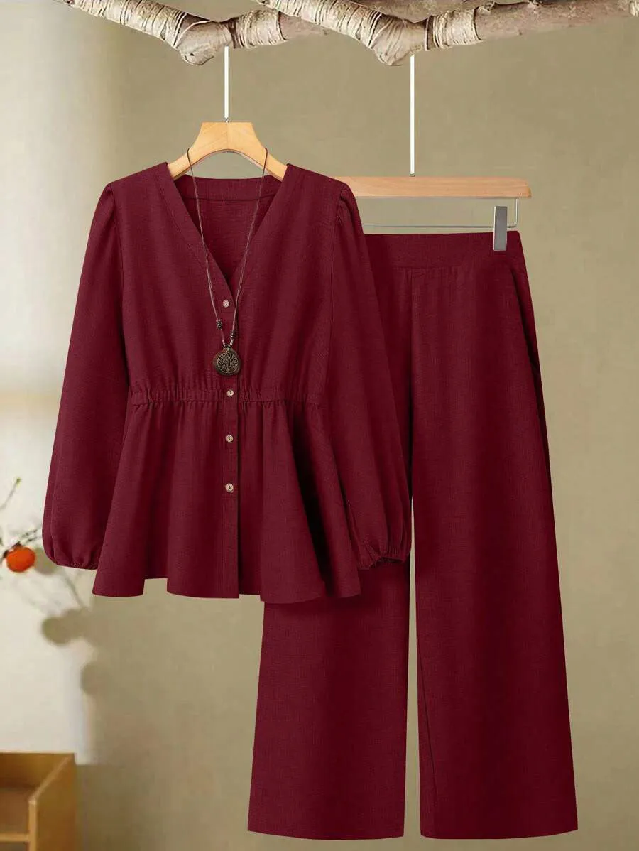 Women's woven polyester two-piece suit in wine red with button-front long-sleeved top and matching full-length trousers