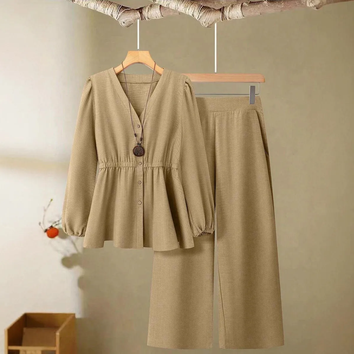 Women's woven polyester two-piece suit in wine red with button-front long-sleeved top and matching full-length trousers