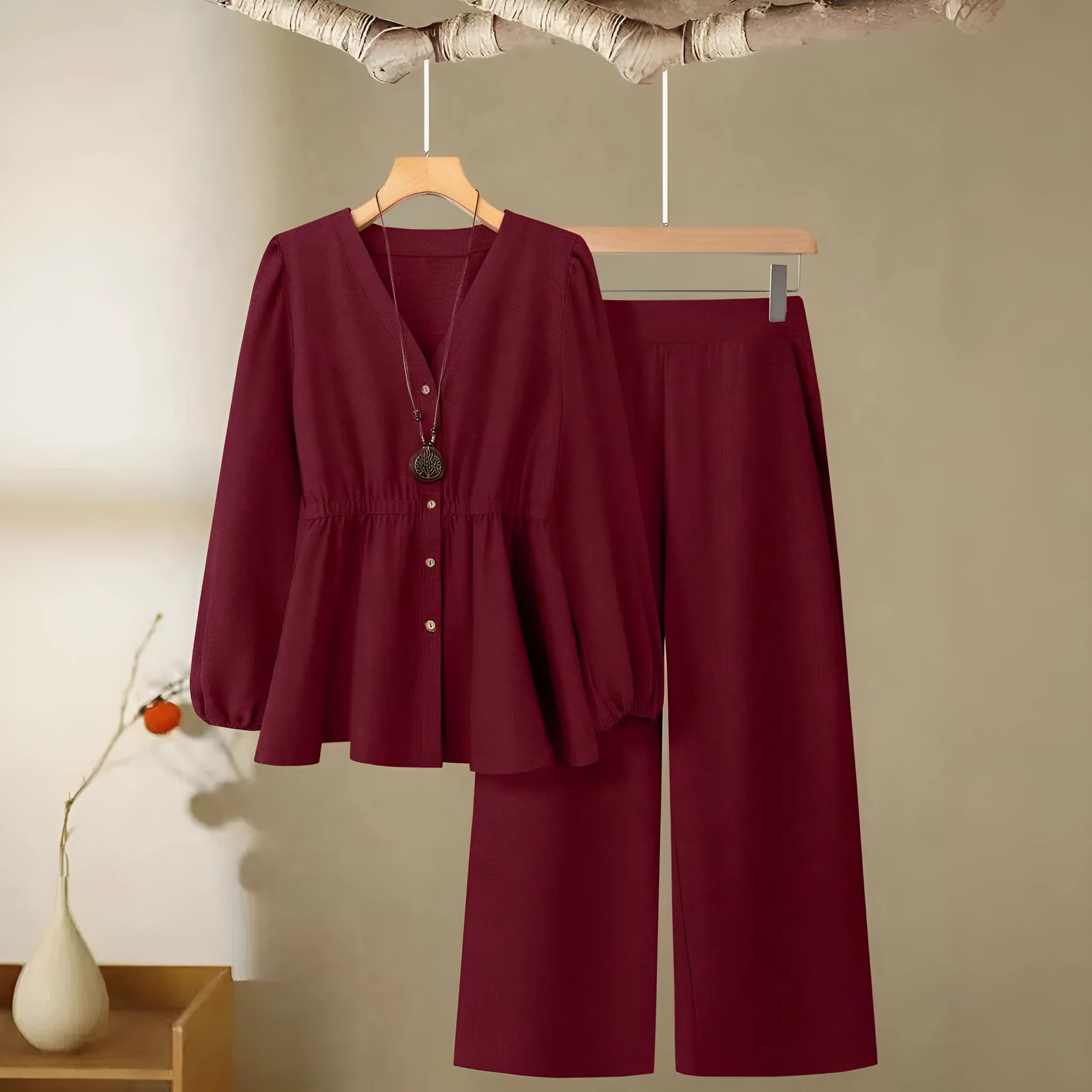 Women's woven polyester two-piece suit in wine red with button-front long-sleeved top and matching full-length trousers