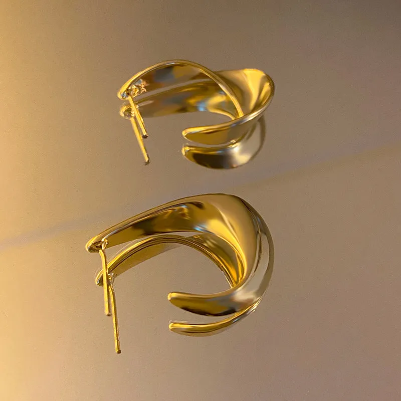 Twisted geometric metal earrings with circular design in gold or silver electroplated finish