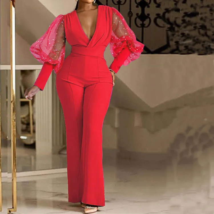 Women's wide leg jumpsuit with mesh stitching detail on long sleeves and elastic waistband